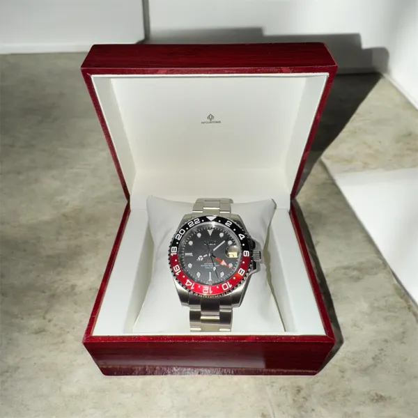 Red and black GMT watch in its presentation box