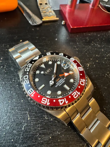 GMT watch with a red and black bezel