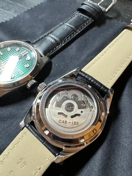 Matching watches with a personalized exhibition caseback